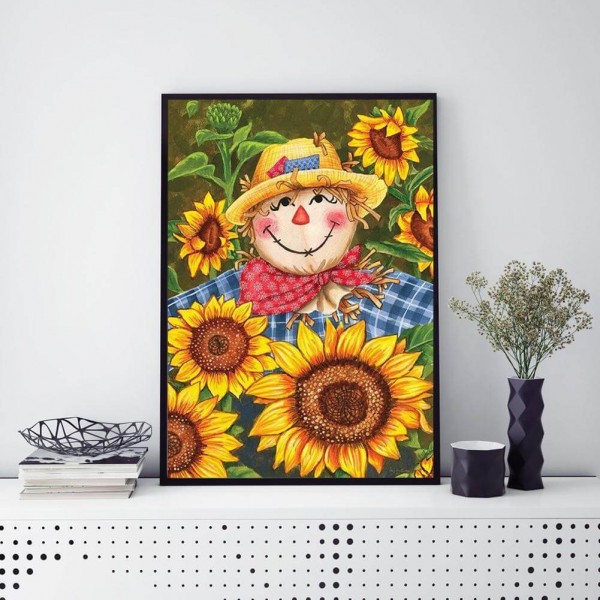 Épouvantail parmi les tournesols 50x70cm